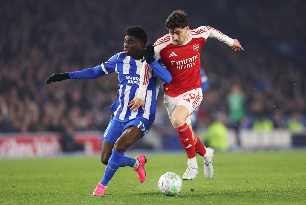 BRIGHTON, ENGLAND - MARCH 04: Kai Havertz of Arsenal battles for possession with Carlos Baleba of Brighton & Hove Albion during the Premier League match between Brighton & Hove Albion and Arsenal at Amex Stadium on March 04, 2026 in Brighton, England. (Photo by Ryan Pierse/Getty Images)