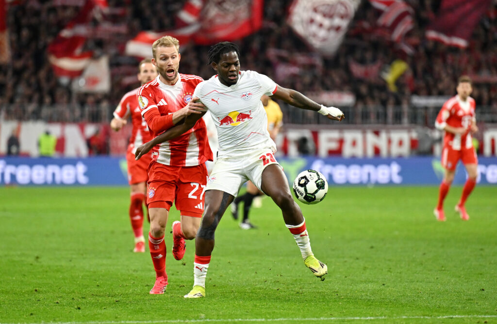MUNICH, GERMANY - FEBRUARY 11: Castello Lukeba of RB Leipzig is challenged by Konrad Laimer of FC Bayern Munich during the DFB Cup Quarter Final match between FC Bayern München and RB Leipzig at Allianz Arena on February 11, 2026 in Munich, Germany. (Photo by Sebastian Widmann/Getty Images)