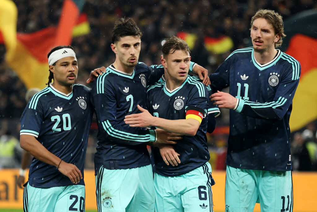 STUTTGART, GERMANY - MARCH 30: Kai Havertz of Germany celebrates the team's first goal with teammates Serge Gnabry, Joshua Kimmich and Nick Woltemade during the international friendly match between Germany and Ghana at MHP Arena on March 30, 2026 in Stuttgart, Germany. (Photo by Alex Grimm/Getty Images)