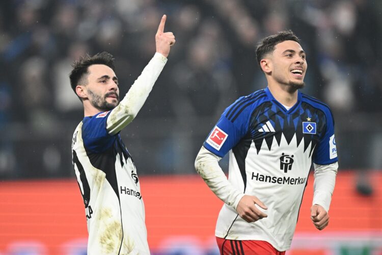 Fabio Vieira of Hamburger SV celebrates scoring his team's first goal with teammate William Mikelbrencis during the Bundesliga match between Hambur...