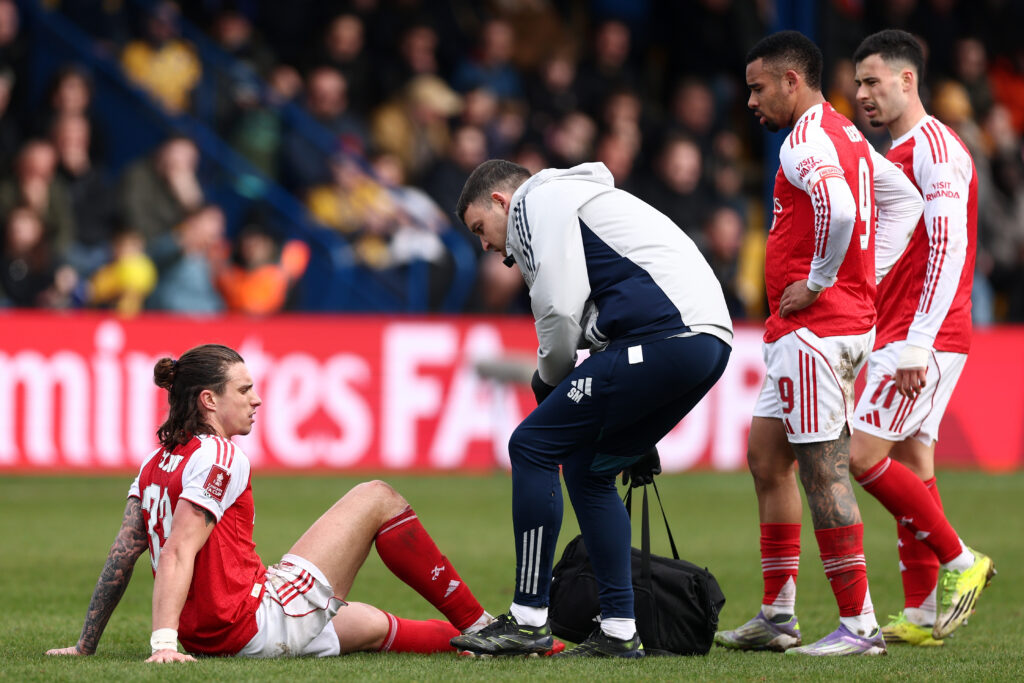 MANSFIELD, ENGLAND - MARCH 07: Riccardo Calafiori of Arsenal receives medical treatment during the Emirates FA Cup Fifth Round match between Mansfield Town and Arsenal at One Call Stadium on March 07, 2026 in Mansfield, England. (Photo by Alex Pantling/Getty Images)