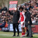 Mikel Arteta, Manager of Arsenal, speaks to Jaden Dixon of Arsenal before he comes on as a substitute during the Emirates FA Cup Fifth Round match between Mansfield Town and Arsenal at One Call Stadium on March 07, 2026 in Mansfield, England. (Photo by Alex Pantling/Getty Images)