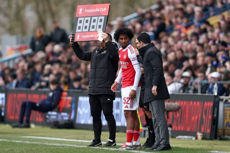 Mikel Arteta, Manager of Arsenal, speaks to Jaden Dixon of Arsenal before he comes on as a substitute during the Emirates FA Cup Fifth Round match ...
