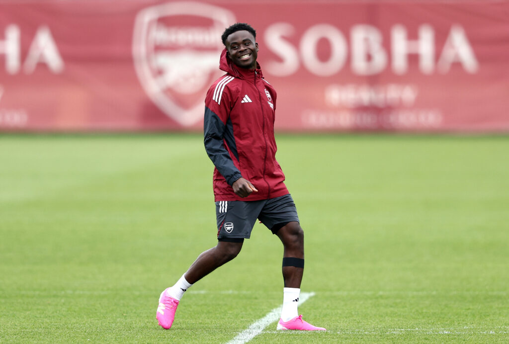 Bukayo Saka smiling in Arsenal training ahead of the Champions League semi final first leg against Atletico Madrid