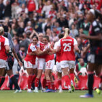 Arsenal women celebrate scoring an equaliser against Lyon