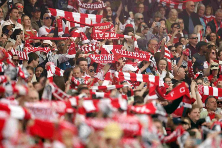Arsenal fans raise their scarves as Arsenal women take on Lyon the CHampions League semi final first leg
