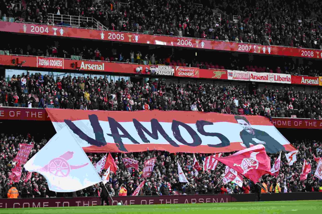 LONDON, ENGLAND - APRIL 11: Fans of Arsenal unveil a banner that displays "Vamos" and a photo of Manager of Arsenal, Mikel Arteta prior to the Premier League match between Arsenal and Bournemouth at Emirates Stadium on April 11, 2026 in London, England. (Photo by Shaun Botterill/Getty Images)