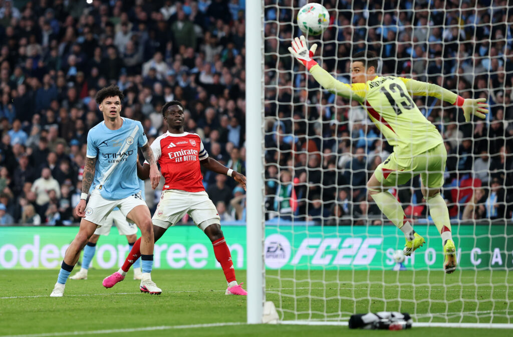 Kepa dives but is unable to save Nico O'Reilly's header in the Carabao Cup final as Bukayo Saka looks on