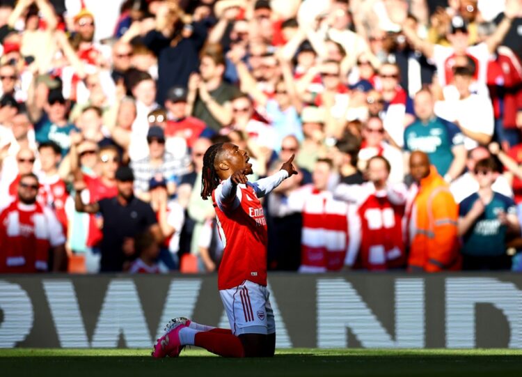 Eberechi Eze is on his knees with his hands raised to the heavens as he celebrates scoring a brilliant goal against Newcastle in front of an Arsena...