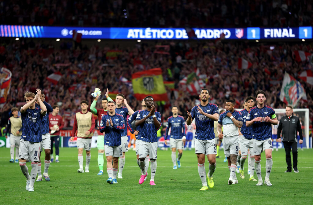 Arsenal players applaud Arsenal fans after their 1-1 draw in Madrid against Atletico