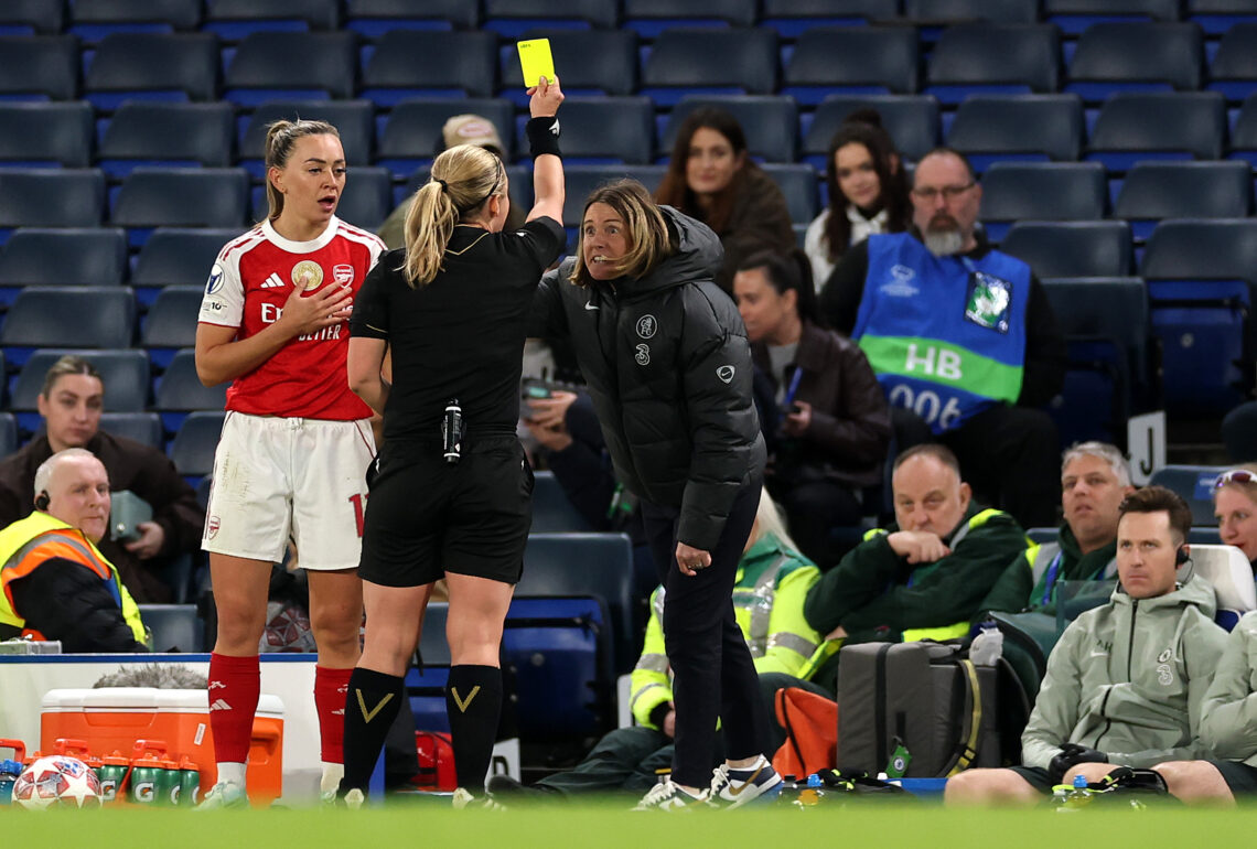 LONDON, ENGLAND - APRIL 01: Referee Frida Mia Klarlund shows a yellow card to Sonia Bompastor, Manager of Chelsea, as Katie McCabe of Arsenal looks...