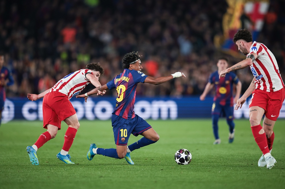 Atletico take control of Barca tie - winner to face Arsenal or Sporting 1 Lamine Yamal of FC Barcelona is tackled by Julian Alvarez of Atletico Madrid during the UEFA Champions League 2025/26 Quarter-Final First Leg match...