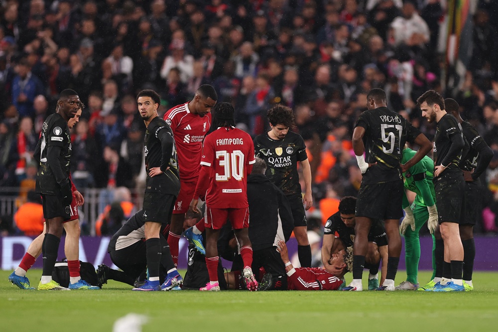 Hugo Ekitike of Liverpool receives medical treatment after picking up an ankle injury during the UEFA Champions League 2025/26 Quarter-Final Second Leg match between Liverpool FC and Paris Saint-Germain FC at Anfield on April 14, 2026 in Liverpool, England. (Photo by Carl Recine/Getty Images)