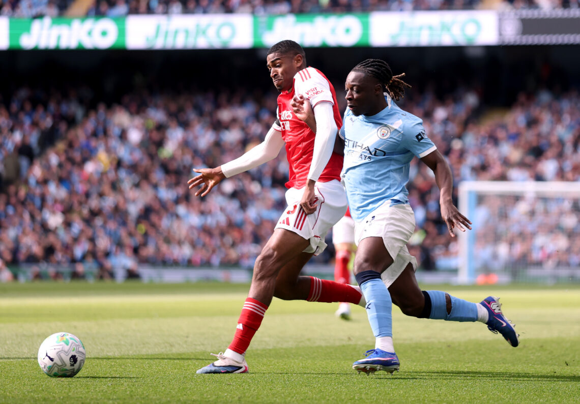 Cristhian Mosquera challenges shoulder to shoulder with Manchester City's Jeremy Doku