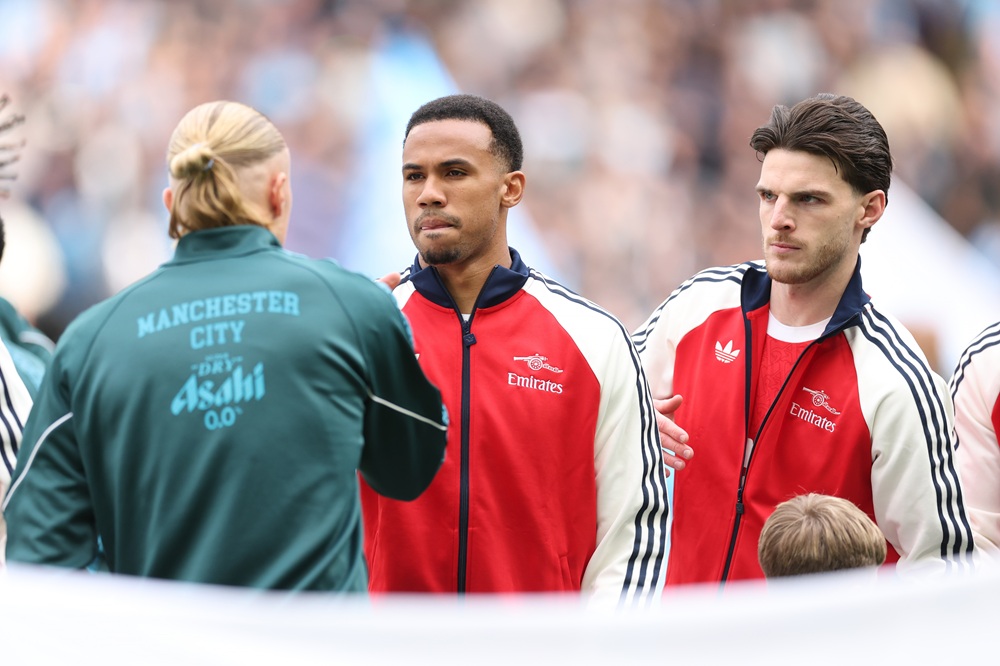 Erling Haland of Manchester City shakes the hand of Gabriel of Arsenal as Declan Rice looks on before the Premier League match between Manchester City and Arsenal at Etihad Stadium on April 19, 2026 in Manchester, England. (Photo by Michael Regan/Getty Images)