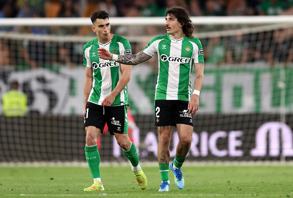 Hector Bellerin of Real Betis celebrates scoring his team's first goal with teammate Marc Roca during the LaLiga EA Sports match between Real Betis Balompie and Real Madrid CF at Estadio La Cartuja on April 24, 2026 in Seville, Spain. (Photo by Fran Santiago/Getty Images)
