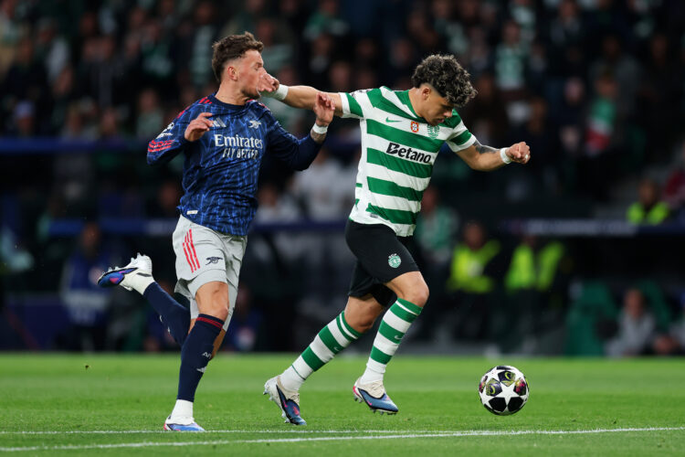 LISBON, PORTUGAL - APRIL 07: Maximiliano Araujo of Sporting Clube de Portugal is challenged by Ben White of Arsenal during the UEFA Champions Leagu...