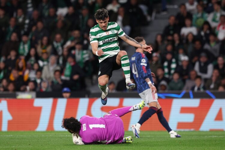 Maximiliano Araujo of Sporting Clube de Portugal has the ball saved at his feet by David Raya of Arsenal during the UEFA Champions League 2025/26 Q...