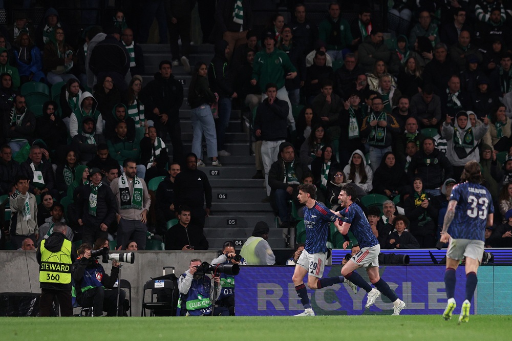 Arsenal qualify for Champions League with Sporting CP win 2 Kai Havertz of Arsenal celebrates scoring his team's first goal with teammate Declan Rice during the UEFA Champions League 2025/26 Quarter-Final First Leg match between Sporting Clube de Portugal and Arsenal FC at Estadio Jose Alvalade on April 07, 2026 in Lisbon, Portugal. (Photo by Carlos Rodrigues/Getty Images)