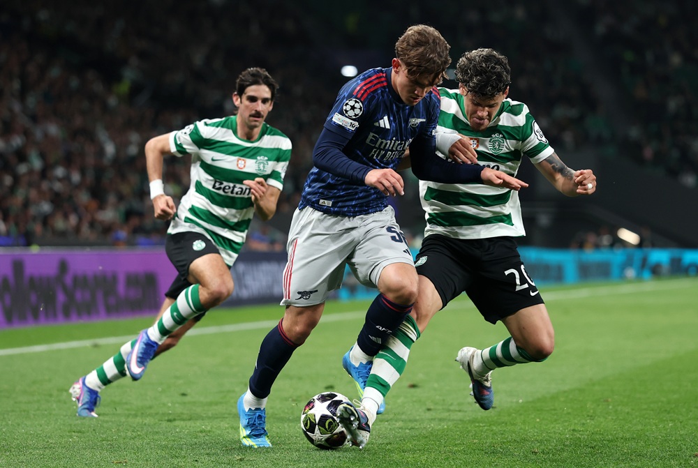 Max Dowman of Arsenal is challenged by Maximiliano Araujo of Sporting Clube de Portugal during the UEFA Champions League 2025/26 Quarter-Final First Leg match between Sporting Clube de Portugal and Arsenal FC at Estadio Jose Alvalade on April 07, 2026 in Lisbon, Portugal. (Photo by Clive Brunskill/Getty Images)