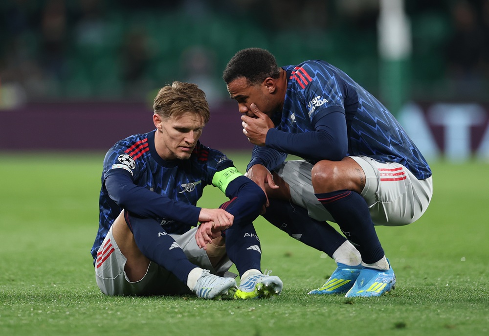 Arteta offers Odegaard injury update after 'limp' reports 1 Martin Odegaard of Arsenal is spoken to by teammate Gabriel during the UEFA Champions League 2025/26 Quarter-Final First Leg match between Sporting...