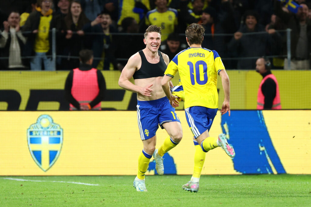 SOLNA, SWEDEN - MARCH 31: Viktor Gyoekeres of Sweden celebrates victory with teammate Benjamin Nygren following the FIFA World Cup 2026 European Qualifiers KO play-offs match between Sweden and Poland at Strawberry Arena on March 31, 2026 in Solna, Sweden. (Photo by Michael Campanella/Getty Images)