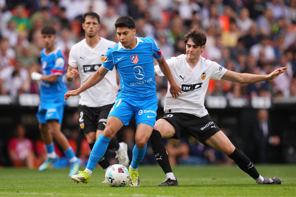 Obed Vargas of Atletico de Madrid is challenged by Javi Guerra of Valencia CF during the LaLiga EA Sports match between Valencia CF and Atletico de Madrid at Estadi de Mestalla on May 02, 2026 in Valencia, Spain.