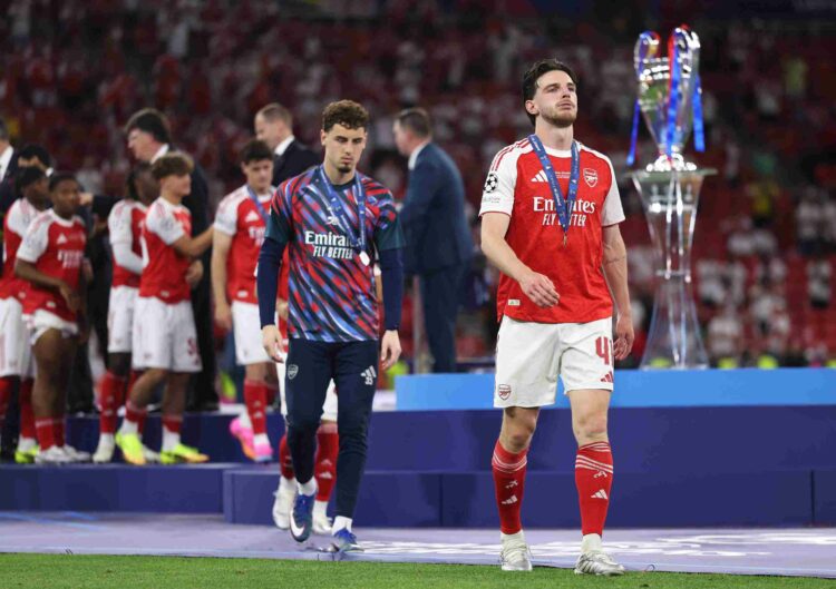 Declan Rice of Arsenal walks past the UEFA Champions League trophy after the UEFA Champions League Final 2026 match between Paris Saint-Germain and...