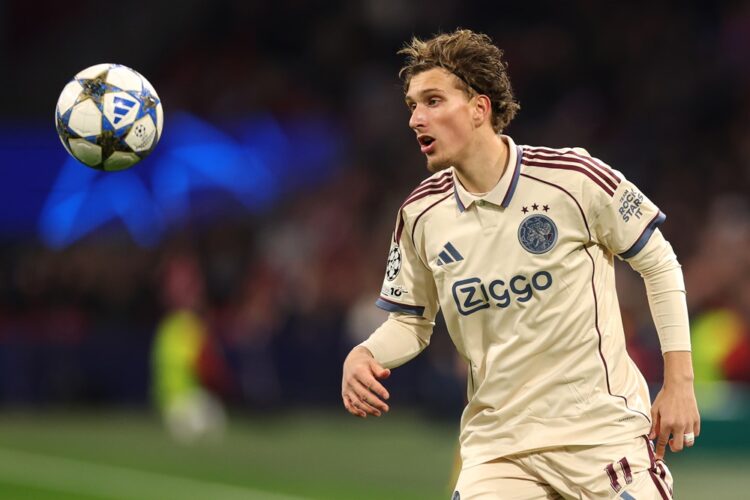 Mika Godts of Ajax in action during the UEFA Champions League 2025/26 League Phase MD5 match between AFC Ajax and SL Benfica at Johan Cruijff Arena...