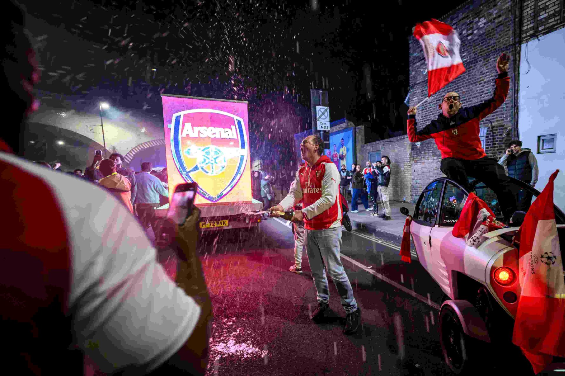 LONDON, ENGLAND - MAY 19: Fans celebrate outside Emirates Stadium as Arsenal take the Premier League title on May 19, 2026 in London, England. Arsenal have won their first Premier League title in 22 years after Manchester City drew 1-1 with Bournemouth. (Photo by Leon Neal/Getty Images)