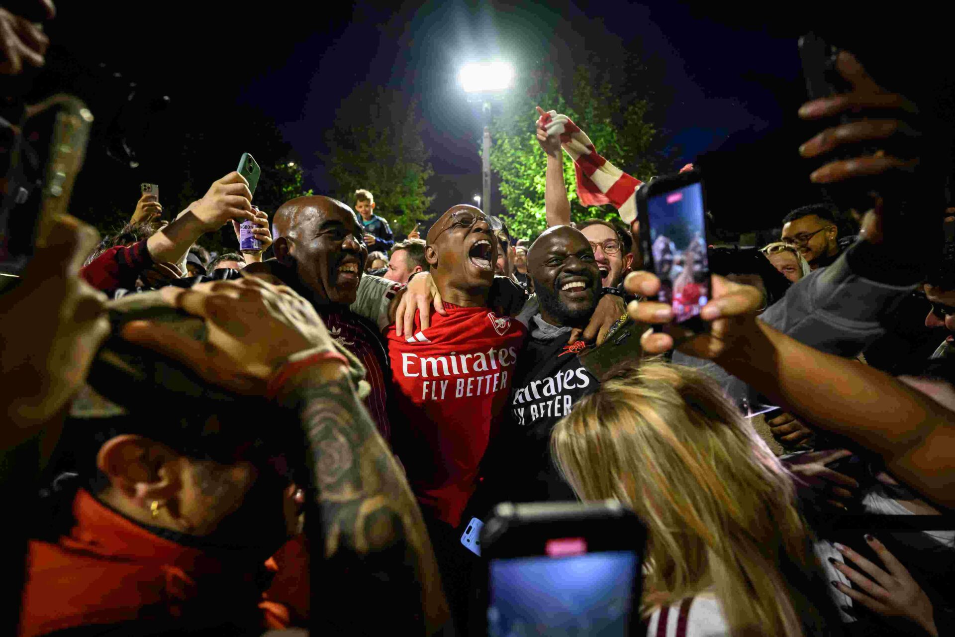 LONDON, ENGLAND - MAY 19: English media personality and former Arsenal footballer Ian Wright celebrates with supporters at Emirates Stadium as Arsenal take the Premier League title on May 19, 2026 in London, England. Arsenal have won their first Premier League title in 22 years after Manchester City drew 1-1 with Bournemouth. (Photo by Leon Neal/Getty Images)