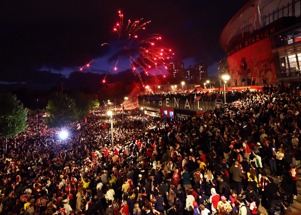 Arsenal fans celebrate winning the Premier League after Manchester City failed to win away to Bournemouth at Emirates Stadium on May 19, 2026 in London, England.