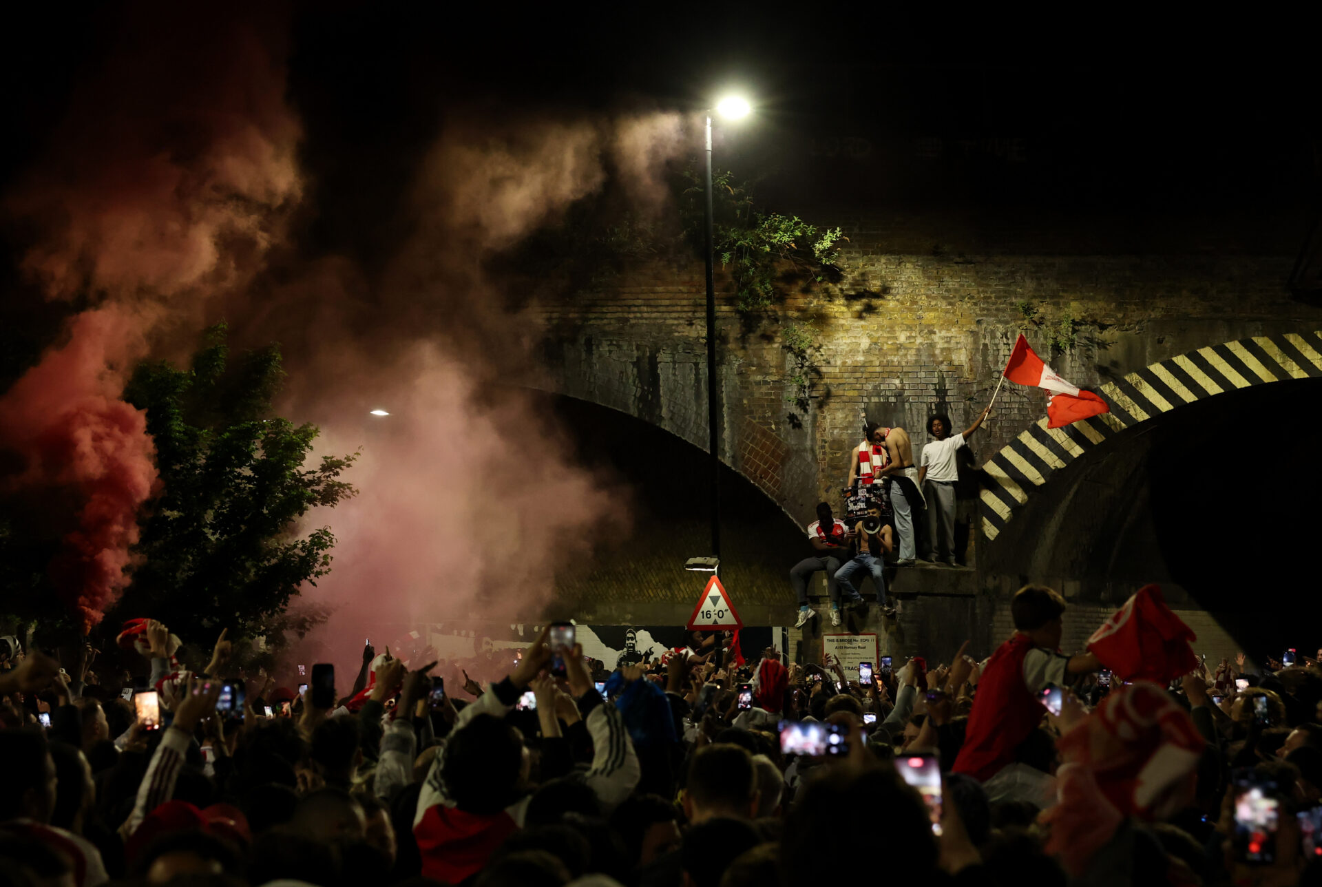LONDON, ENGLAND - MAY 19: Fans celebrate outside Emirates Stadium as Arsenal take the Premier League title on May 19, 2026 in London, England. Arsenal have won their first Premier League title in 22 years after Manchester City drew 1-1 with Bournemouth. (Photo by Leon Neal/Getty Images)