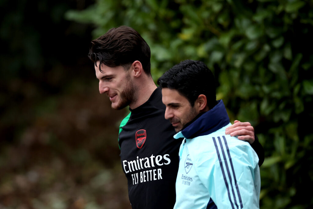 Mikel Arteta, Manager of Arsenal, and Declan Rice make their way out for the UEFA Champions League 2024/25 League Phase MD6 training session at Sobha Realty Training Centre on December 10, 2024