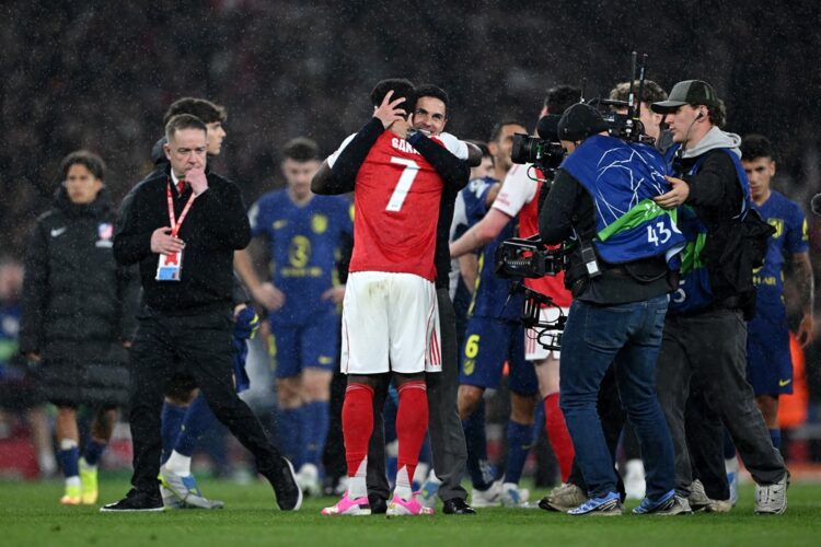 Mikel Arteta, Manager of Arsenal, and Bukayo Saka of Arsenal celebrate progressing to the final of the UEFA Champions League 2025/26 after the team...