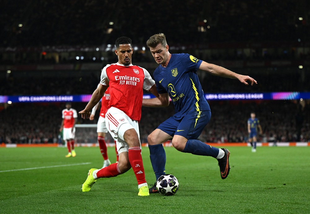 William Saliba of Arsenal and Alexander Sorloth of Atletico de Madrid challenge for the ball during the UEFA Champions League 2025/26 Semi Final Se...