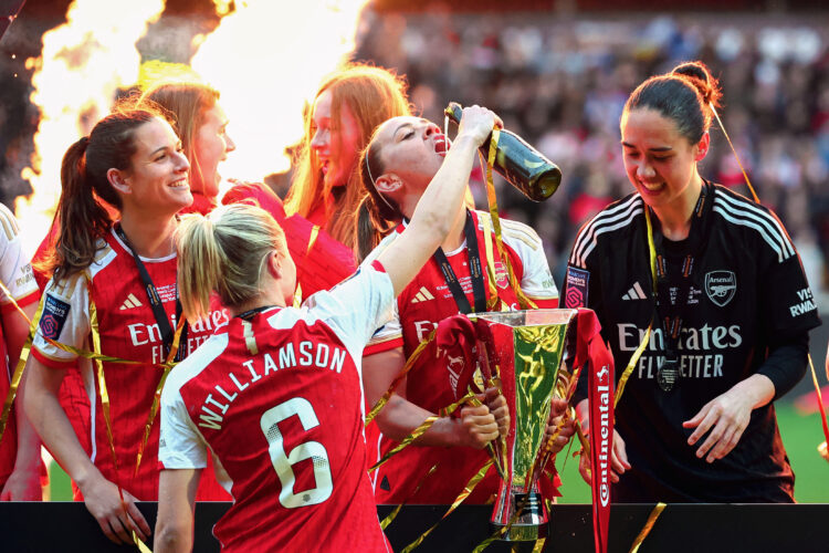 Leah Williamson of Arsenal pours a drink into the mouth of teammate Katie McCabe following the FA Women's Continental Tyres League Cup Final match ...