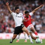 Myles Lewis-Skelly of Arsenal is challenged by Raul Jimenez of Fulham during the Premier League match between Arsenal and Fulham at Emirates Stadium on May 02, 2026 in London, England. (Photo by Alex Pantling/Getty Images)