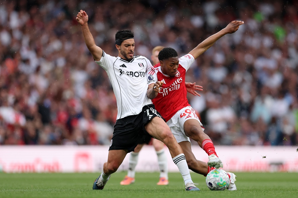 Myles Lewis-Skelly of Arsenal is challenged by Raul Jimenez of Fulham during the Premier League match between Arsenal and Fulham at Emirates Stadium on May 02, 2026 in London, England. (Photo by Alex Pantling/Getty Images)