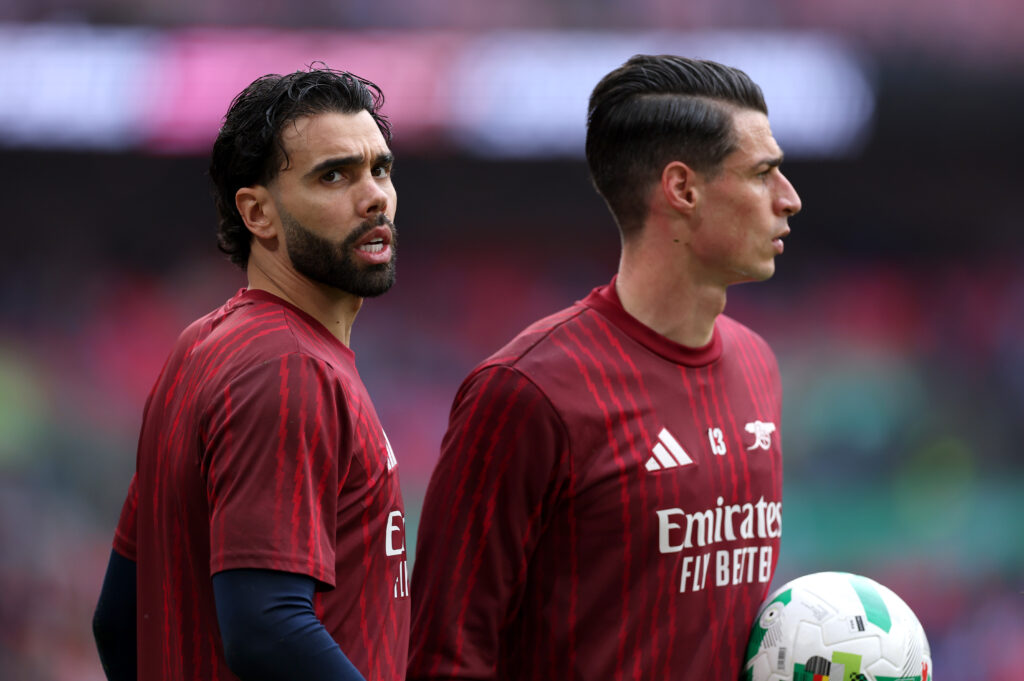 David Raya of Arsenal looks on as he warms up alongside Kepa Arrizabalaga prior to the Carabao Cup Final match between Arsenal and Manchester City at Wembley Stadium on March 22, 2026 in London, England.