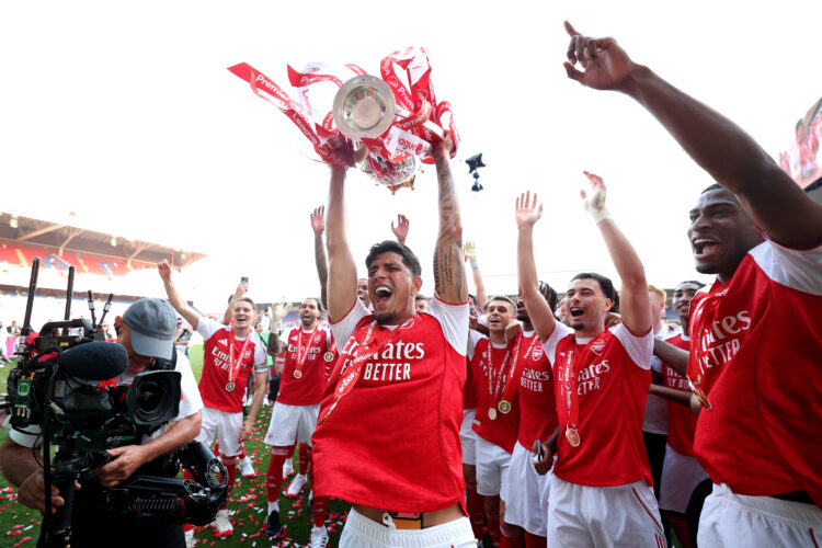LONDON, ENGLAND - MAY 24: Piero Hincapie of Arsenal celebrates with the Premier League trophy with teammates Viktor Gyoekeres, David Raya, Leandro ...