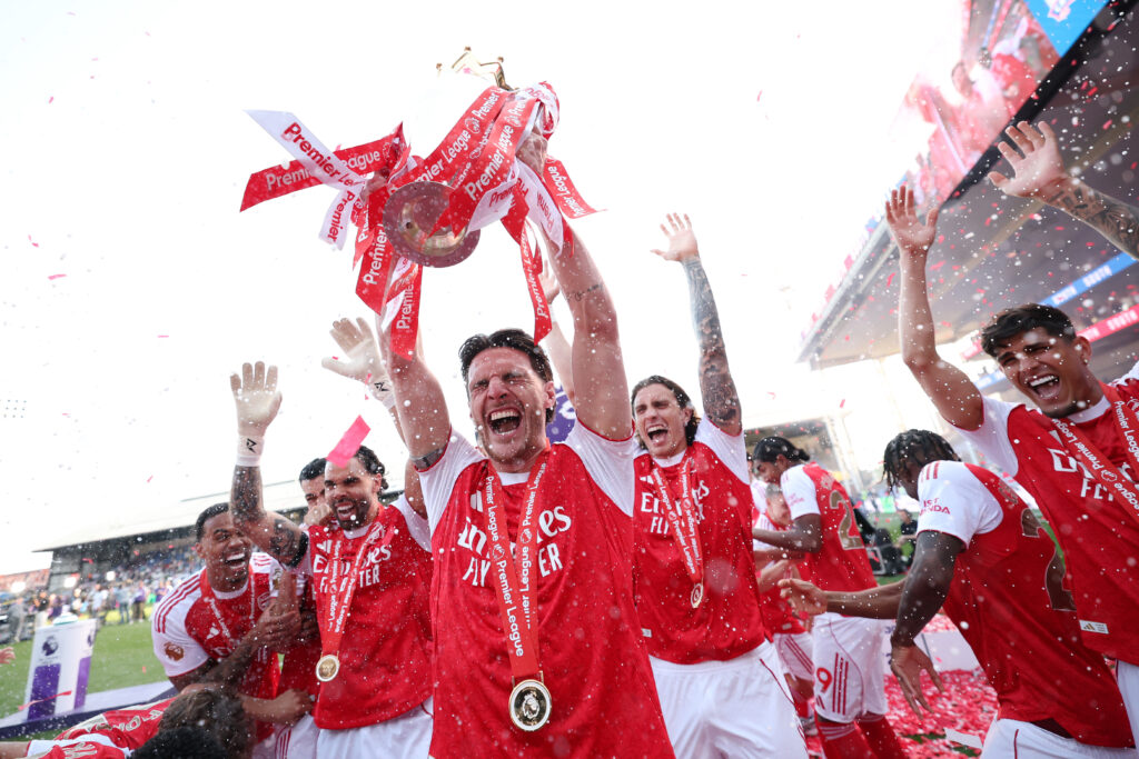 Best photos as Arsenal lift Premier League trophy 2 LONDON, ENGLAND - MAY 24: Declan Rice of Arsenal lifts the Premier League Trophy amongst teammates following their victory in the Premier League match between Crystal Palace and Arsenal at Selhurst Park on May 24, 2026 in London, England. (Photo by Michael Regan/Getty Images For Premier League)