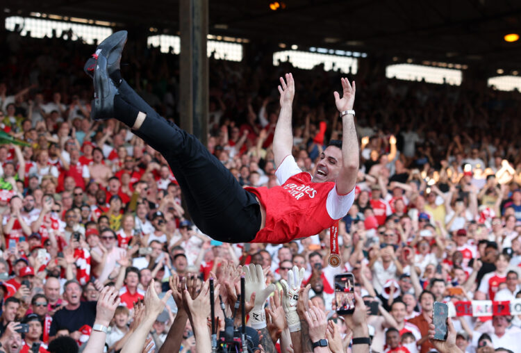 LONDON, ENGLAND - MAY 24: Arsenal players throw Mikel Arteta, Manager of Arsenal, in the air as they celebrate victory after the Premier League mat...