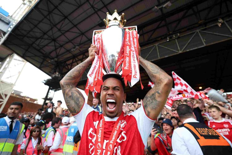 LONDON, ENGLAND - MAY 24: Gabriel of Arsenal celebrates with the Premier League trophy, as Arsenal are crowned the Champions of the Premier League ...