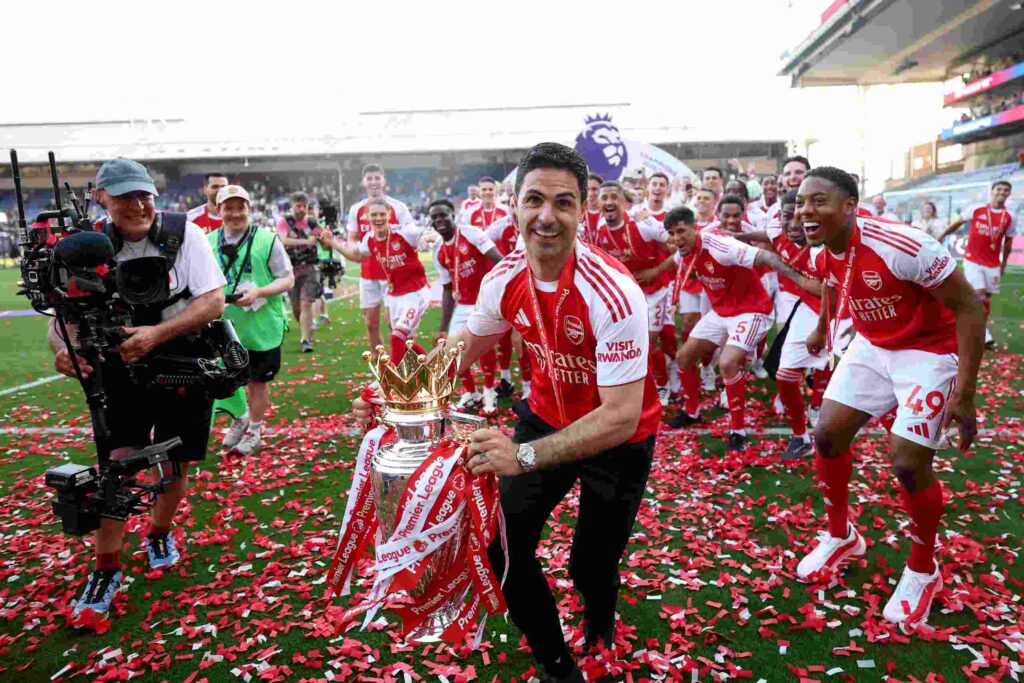 LONDON, ENGLAND - MAY 24: Mikel Arteta, Manager of Arsenal, celebrates with the Premier League trophy, as Arsenal are crowned the Champions of the Premier League for the 2025/26 Season, after the Premier League match between Crystal Palace and Arsenal at Selhurst Park on May 24, 2026 in London, England. (Photo by Michael Regan/Getty Images For Premier League)