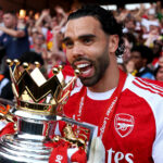 David Raya of Arsenal bites the Premier League trophy as Arsenal are crowned the Champions of the Premier League for the 2025/26 Season, after the Premier League match between Crystal Palace and Arsenal at Selhurst Park on May 24, 2026