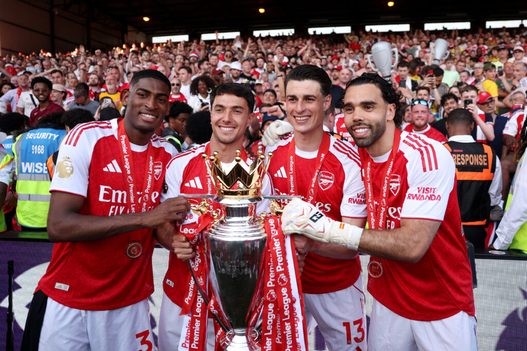 Cristhian Mosquera, Mikel Merino, Kepa Arrizabalaga and David Raya of Arsenal pose for a photograph the Premier League trophy as players of Arsenal celebrate, as they are crowned the Champions of the Premier League for the 2025/26 Season