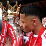 William Saliba of Arsenal kisses the Premier League trophy, as Arsenal are crowned the Champions of the Premier League for the 2025/26 Season, after the Premier League match between Crystal Palace and Arsenal at Selhurst Park on May 24, 2026 in London, England. (Photo by Michael Regan/Getty Images For Premier League)