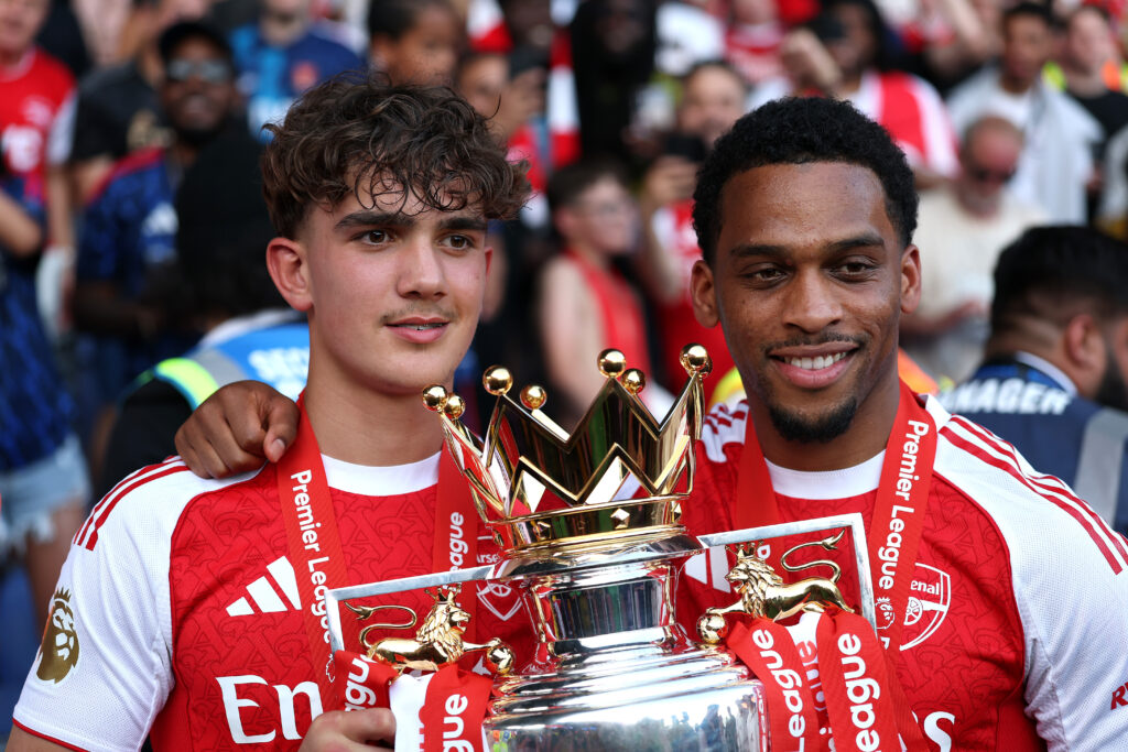 LONDON, ENGLAND - MAY 24: Max Dowman and Jurrien Timber of Arsenal pose for a photo with the Premier League Trophy after their team's victory in the Premier League match between Crystal Palace and Arsenal at Selhurst Park on May 24, 2026 in London, England. (Photo by Justin Setterfield/Getty Images)