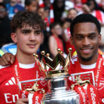 LONDON, ENGLAND - MAY 24: Max Dowman and Jurrien Timber of Arsenal pose for a photo with the Premier League Trophy after their team's victory in the Premier League match between Crystal Palace and Arsenal at Selhurst Park on May 24, 2026 in London, England. (Photo by Justin Setterfield/Getty Images)